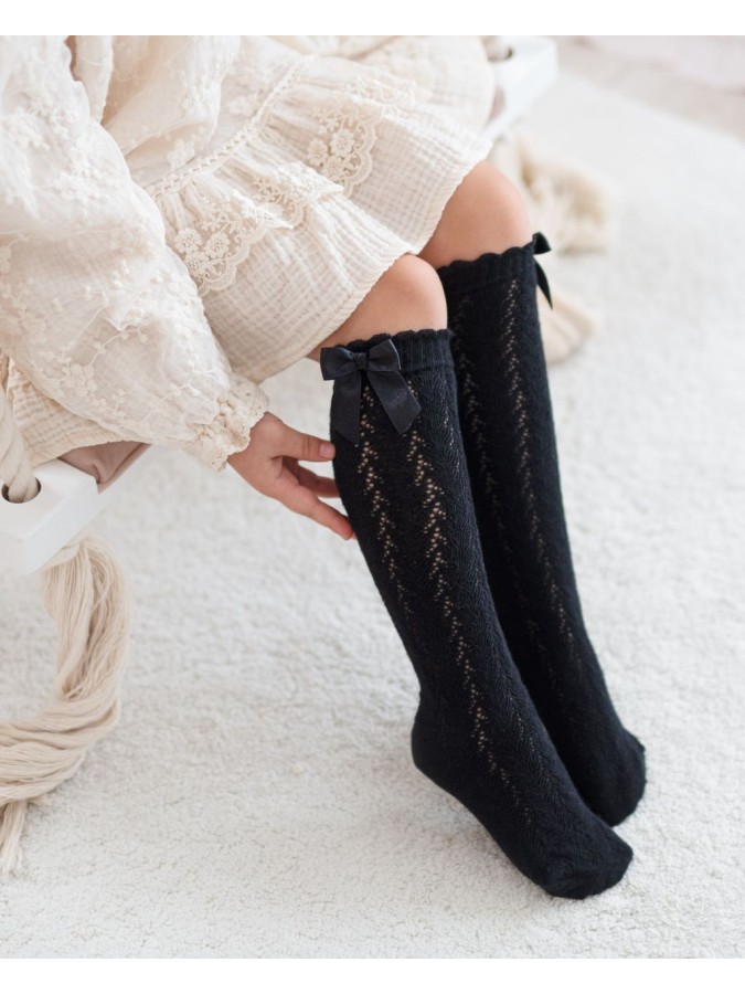Kids' openwork knee socks with a bow